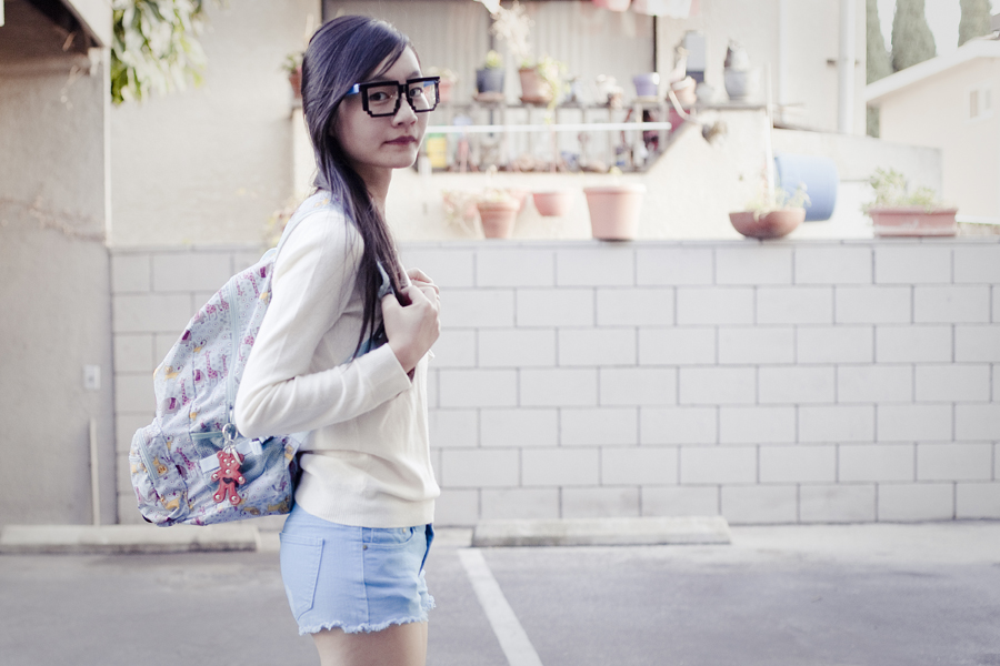 Uniqlo cashmere, Forever21 denim shorts, Dr. Martens hot pink lamper boots, geek glasses.