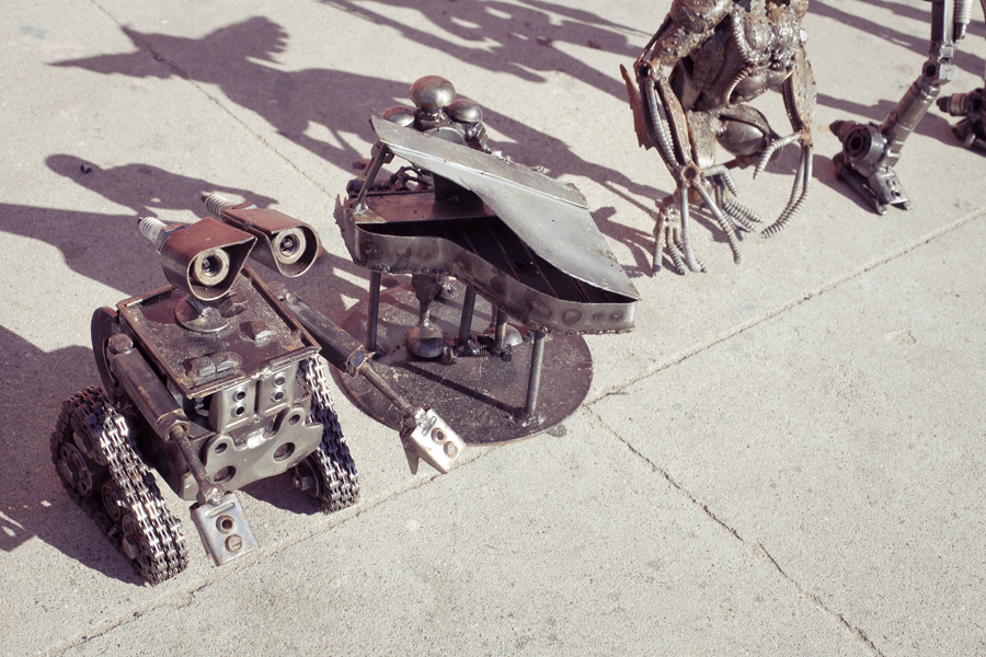 Metal sculptures of pop-culture characters: Wall-e, Aliens.
