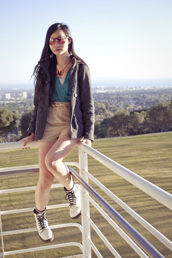Me at the Getty Center, Los Angeles. Outfit details: Forever21 chiffon green tan romper, La Marelle pink bow metal necklace, Uniqlo grey bra-top camisole, Dr. Martens white 8eye boots, Dollhouse grey jacket.