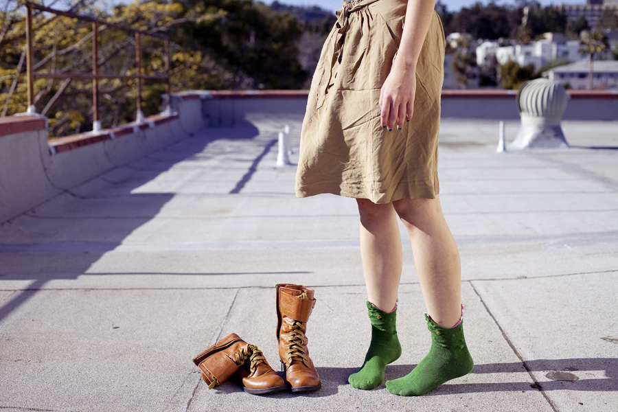 Rooftop photoshoot. Wearing Zara brown front-tie skirt with pockets, green crocodile socks, Top Shoes brown zippered boots.