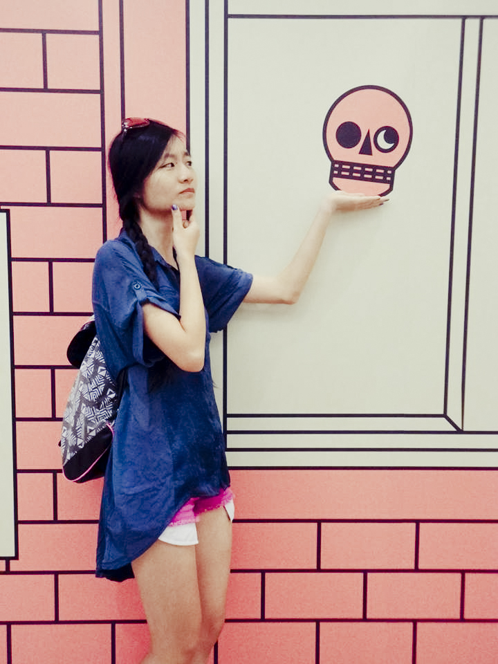 Ren posing with a skull on the wall.