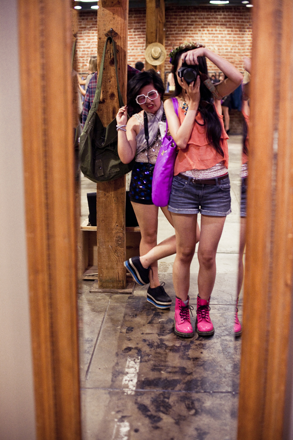 Camay of Reflekt and Ren posing in front of a mirror at the Lookbook x Rebecca Minkoff Denim Launch Party at the Confederacy Boutique in Hollywood, Los Angeles.