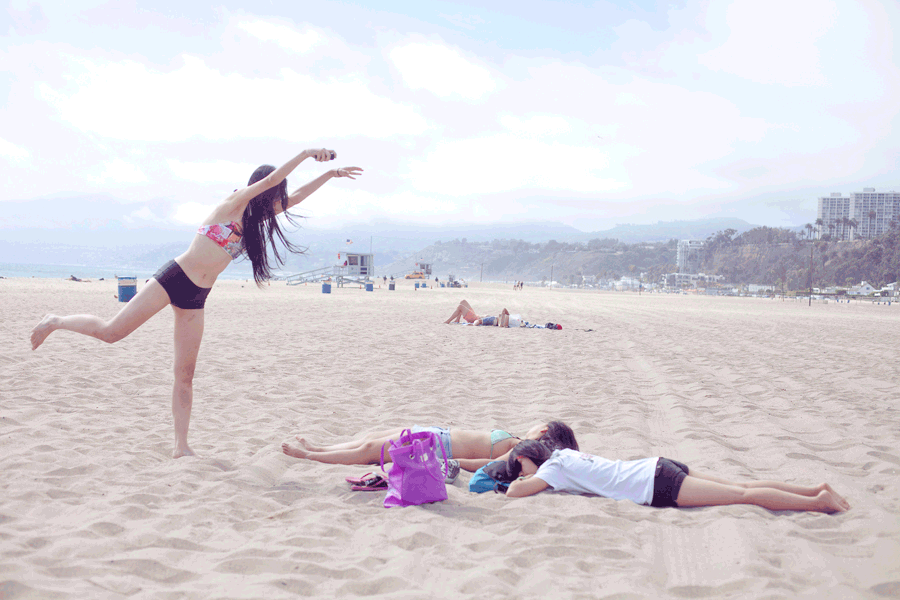 Animated gif of Ren making wacky shots over sunbathing Ela and Lilli at Santa Monica beach.