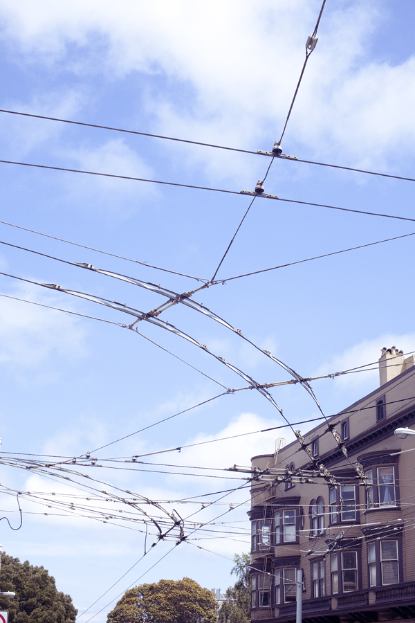 View of electric cable lines for buses on Haight in San Francisco.