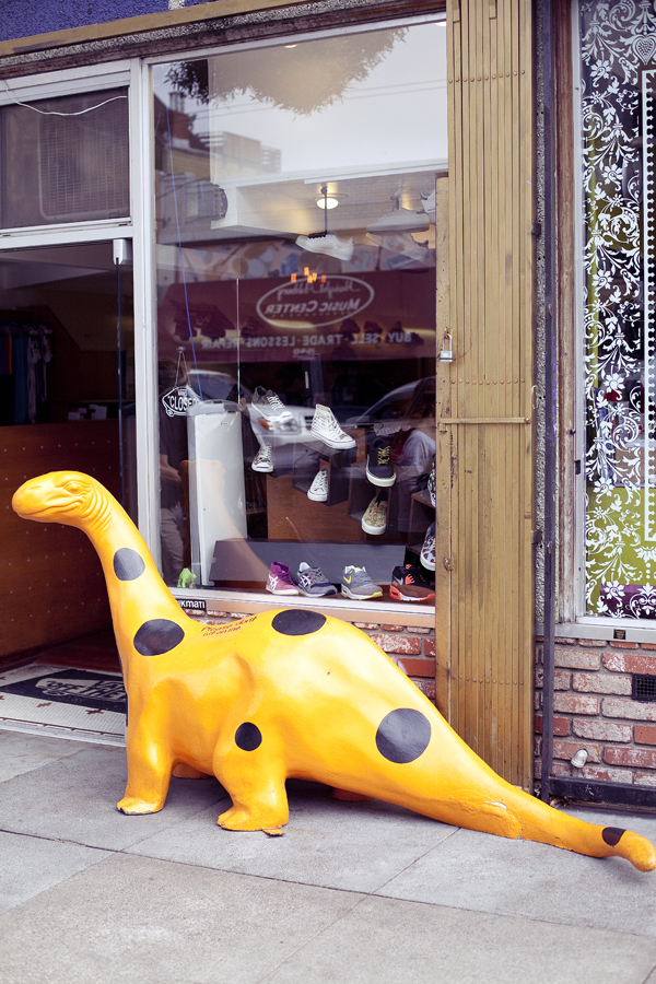 Spotted dinosaur on display outside a store on Haight in San Francisco.