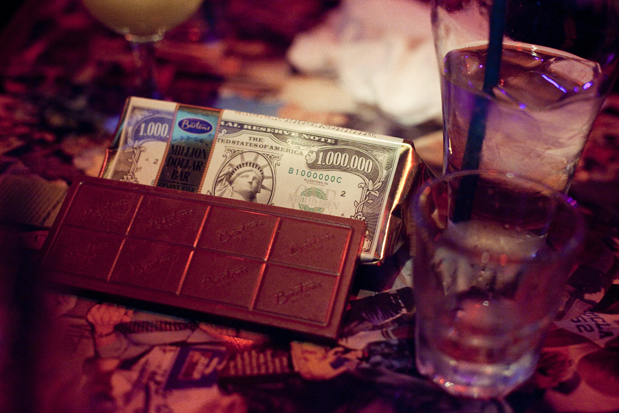 Bar of chocolate in a money cover.
