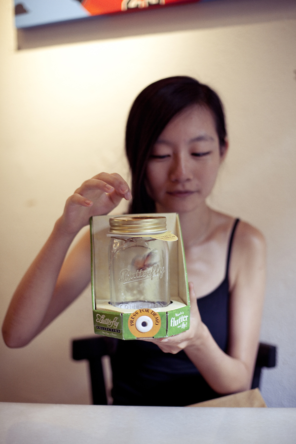 Ren playing with her birthday present of a butterfly in a jar from Ade & Puey.
