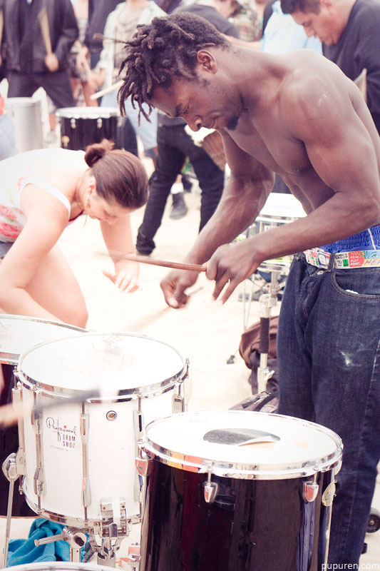 Drummer in a drum circle at Venice beach, Los Angeles.