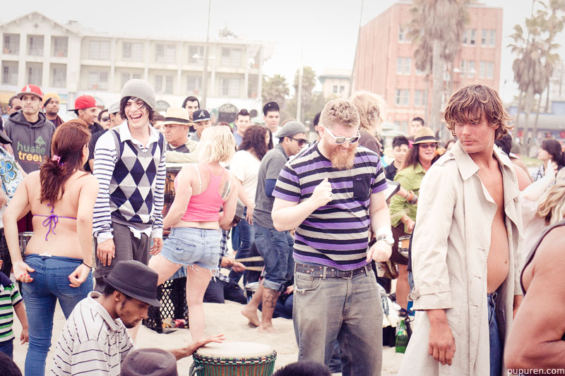 Dancers in a drum circle at Venice beach, Los Angeles.