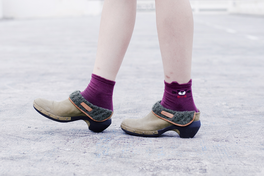 Kiki Socks maroon bear socks and Merrell knit luxe leather clogs.