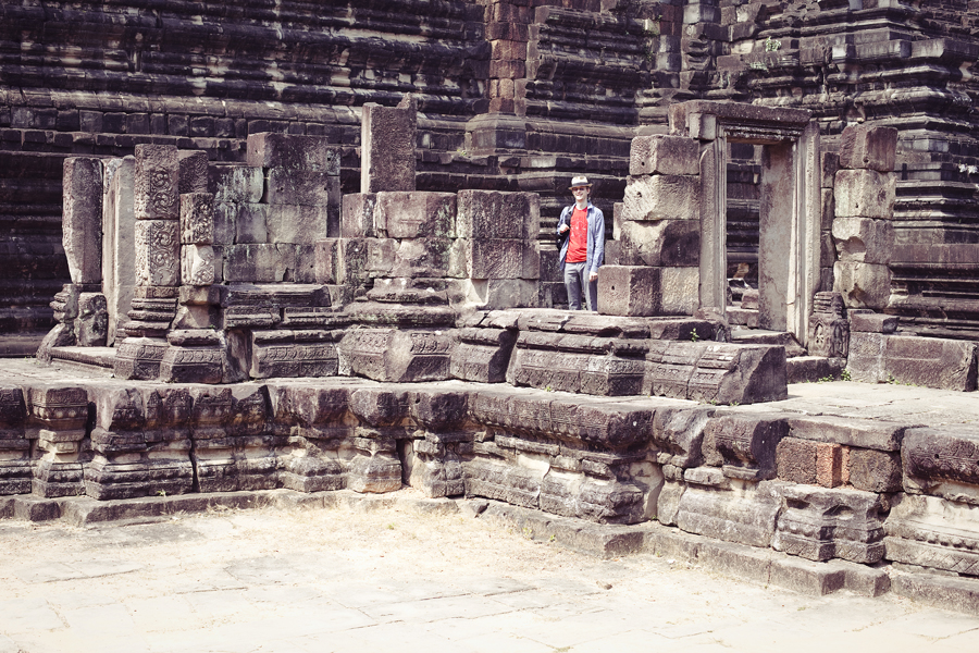 Ottie among the ruins of Baphuon in Angkor Thom, Cambodia.