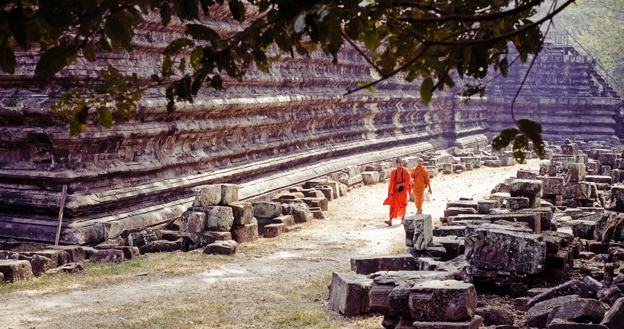 Two monks walking along Baphuon in Angkor Thom, Cambodia.