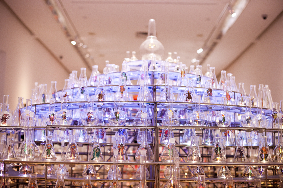 Between Worlds by Nasirun. An installation with leather puppets in glass bottles.