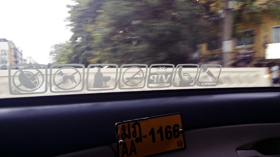 Symbols inside a taxi in Bangkok, Thailand.