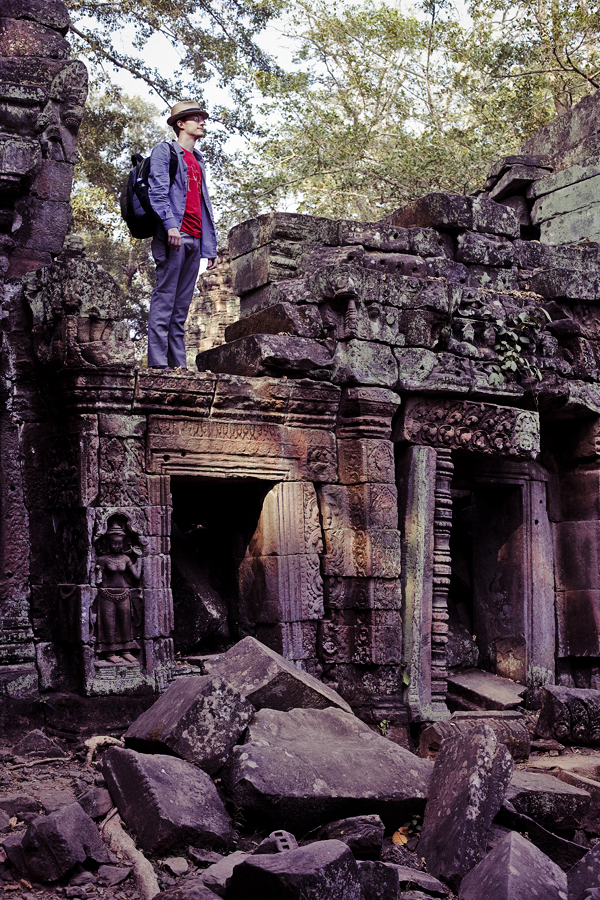 Ottie standing on top of the ruins at Ta Prohm, Cambodia.