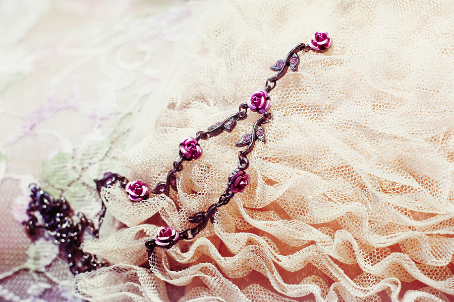 Close-up of Paris Kids dark rose necklace.