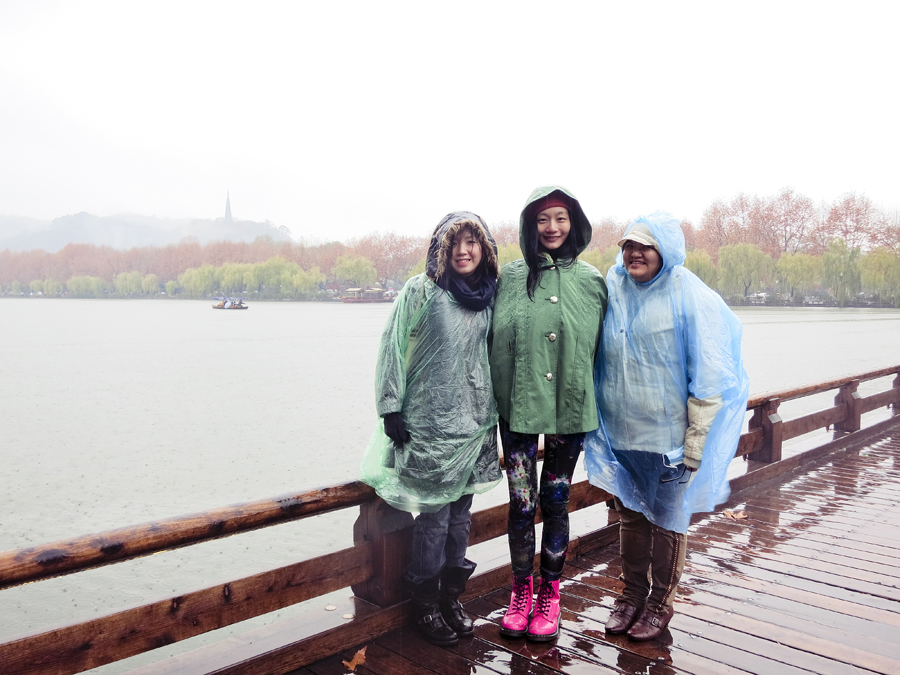 Ade, Ren, and Puey in the rain at West Lake, Hangzhou. Photo from Ade.