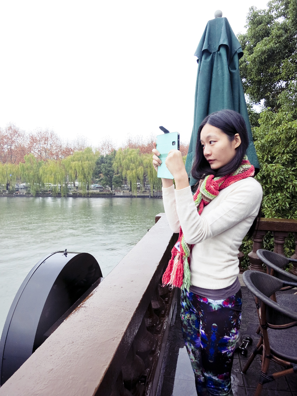 Ren taking photos of the first snow in West Lake, Hangzhou. Photo by Ade.