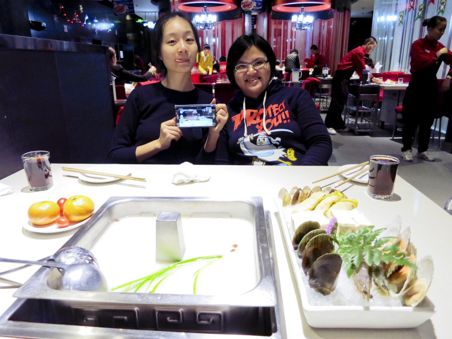 Ren and Puey at Hai Di Lao Hotpot Restaurant in Shanghai.