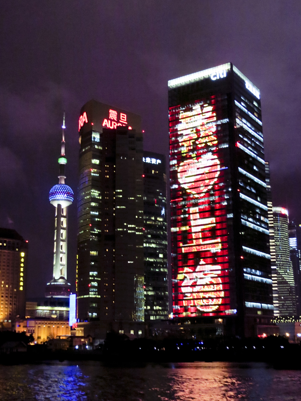 æˆ‘â™¥ä¸Šæµ· (I Love Shanghai) lit-up buildings by the Bund at night, Shanghai. Photo by Ade.