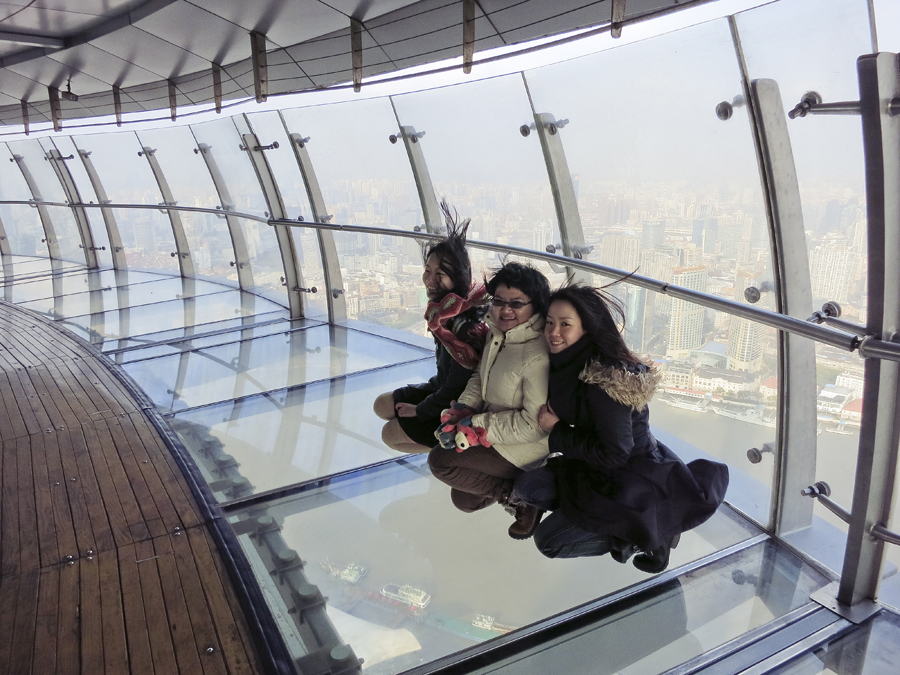 The three of us on the glass floor of the sightseeing corridor of the Oriental Pearl, Shanghai. Photo from Ade.