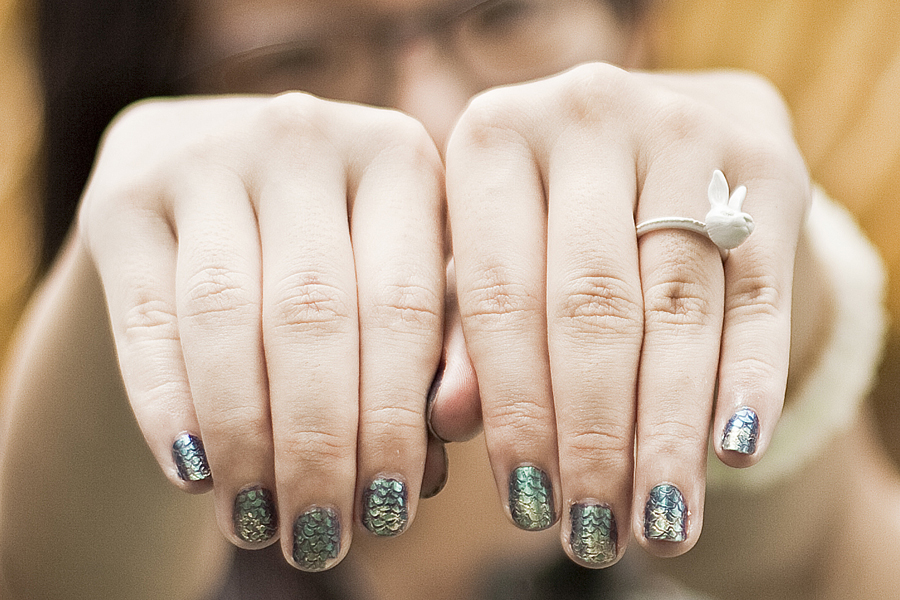 Mermaid nails and white rabbit ring.