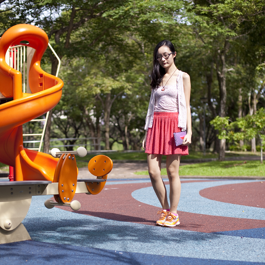 Outfit of the Day (#ootd) at a playground: Gap glasses, Paper Sparrow narwhal necklace, Uniqlo floral bratop, Forever 21 polka dot chiffon top, Zara polka dot skirt, Espirit hot pink socks, Sketchers neon sneakers, Sephora striped purse.