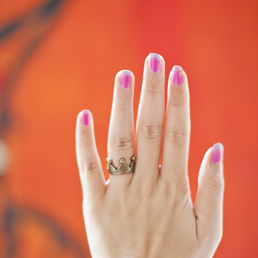 Pink to purple gradient nails and rustic gold crown ring from Wego.