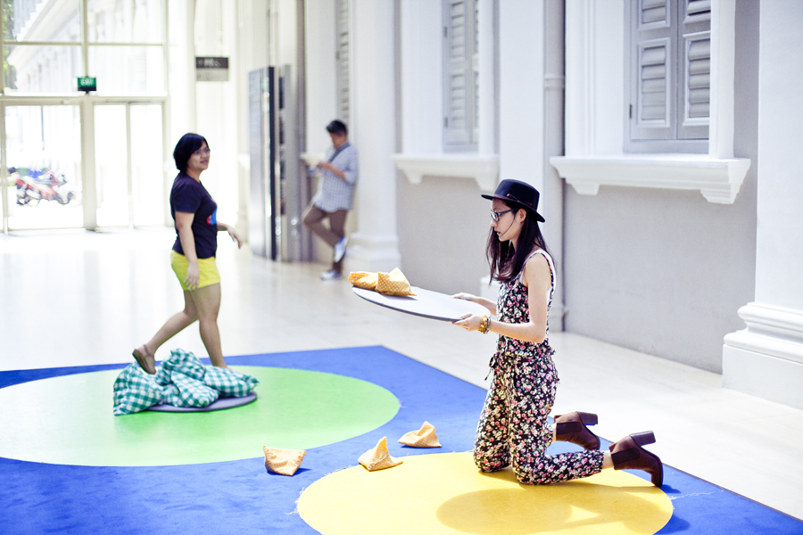 Playing with a contemporary interactive take on the traditional five stones game at the Masak Masak exhibit at the National Museum of Singapore. Photo by Ade.