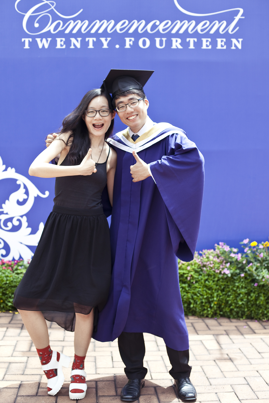 Ren and brother at the NUS Commencement 2014.