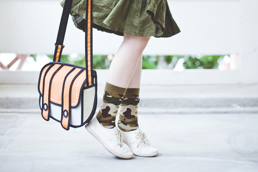 Stance camo socks, Cotton On lace-ups, green flare skirt, orange 2D sling bag.