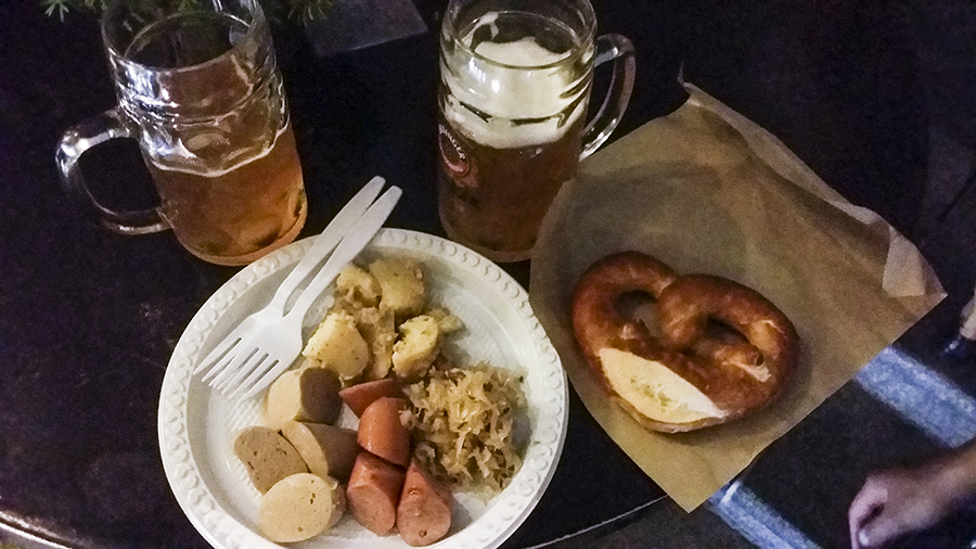 Plate of Bavarian Sausage, a pretzel, and two Erdinger beers at the Oktoberfest The Beer Garden at the Fullerton Hotel.