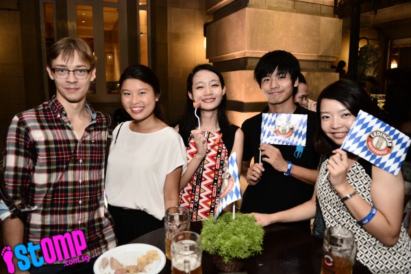 Photo of Deb and Ren and partygoers at Oktoberfest Singapore Fullerton Hotel. Photo by Stomp.