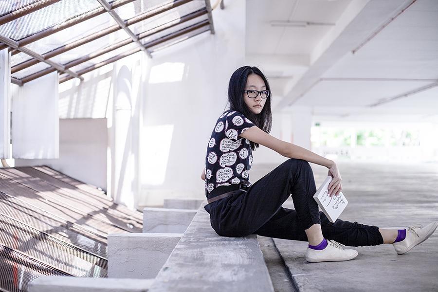 Outfit of the day: Jeffrey Fulvimari x Uniqlo cotton tee, Cotton On black harem pants, purple socks from Esprit, Gap black frame glasses, Beige Cotton On slip-ons, The Unbearable Lightness of Being by Milan Kundera.