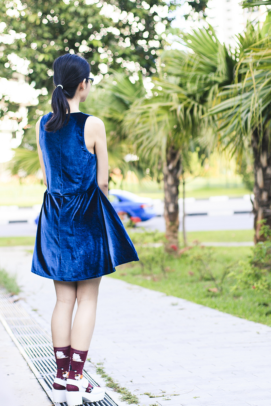 Blue velvet dress from Cotton On, black frame prescription glasses from Gap, cat socks from Taobao, white platform sandals from Taobao.