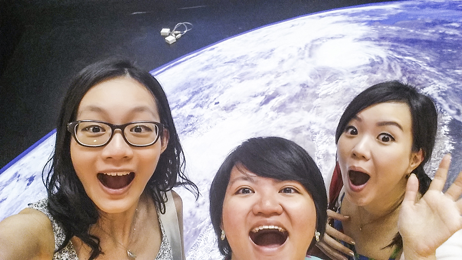 Wefie with Puey and Ade with planet earth from outer space.