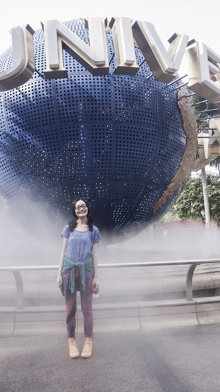 Posing in front of the globe at Universal Studios Singapore.