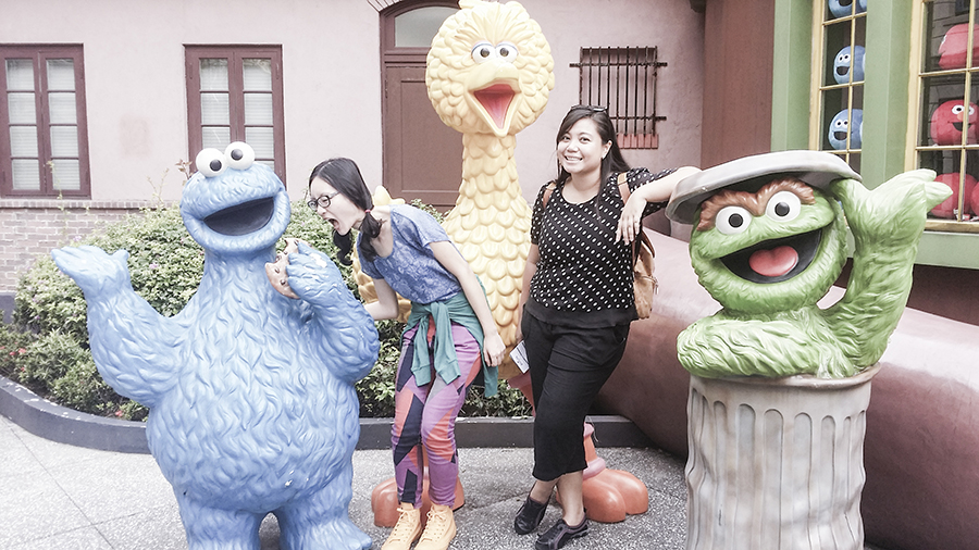 Posing with Sesame Street characters at Universal Studios Singapore.