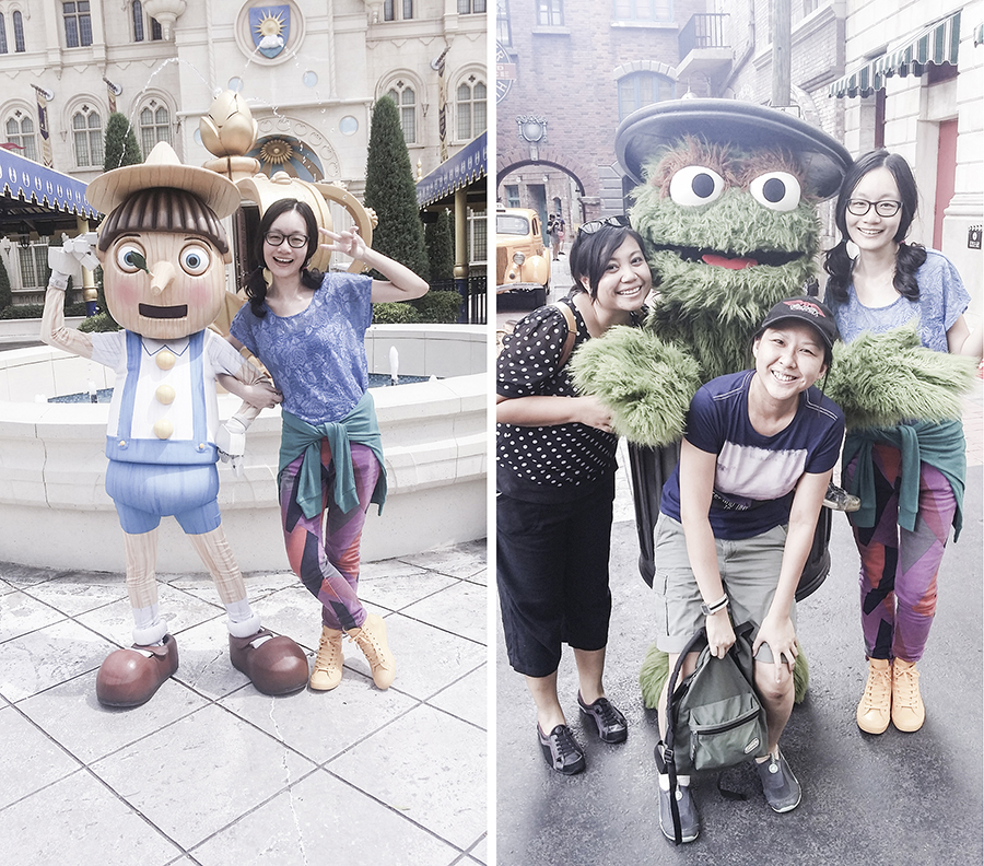 Posing with characters Pinocchio from Shrek and Oscar from Sesame Street at Universal Studios Singapore.