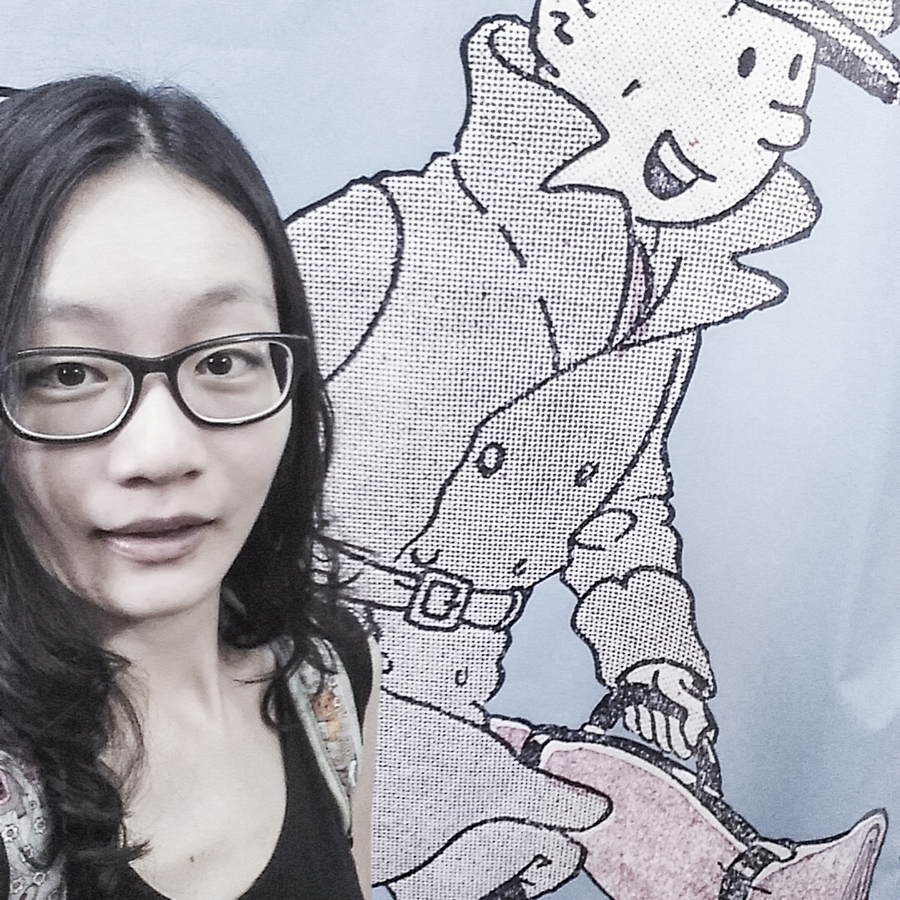 Selfie with a wall banner outside The Tintin Shop in Chinatown, Singapore.