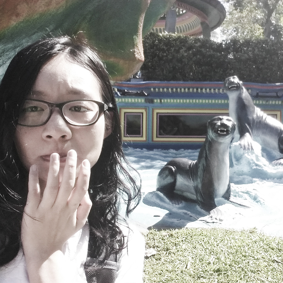 Selfie with scary statues of seals at Haw Par Villa, Singapore.