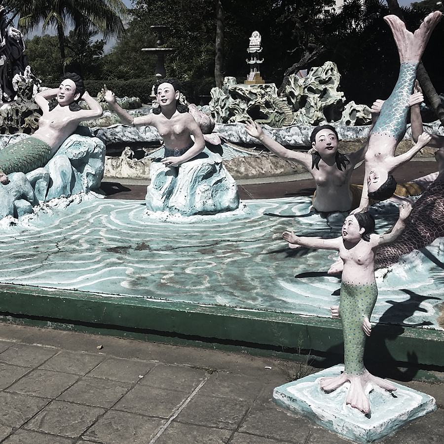 Weird mermaid statues at Haw Par Villa, Singapore.