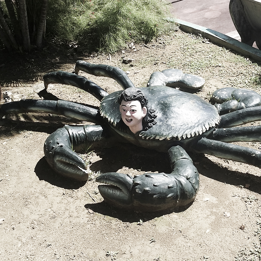 Weird human head on a giant crab's body at Haw Par Villa, Singapore.
