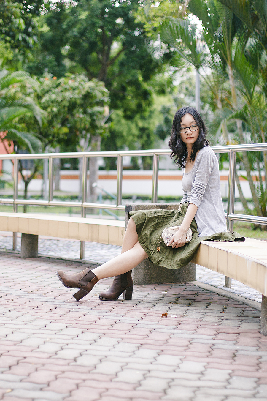 Outfit: EMart grey bratop, Bugis Street green skirt, Gap black frame glasses, Jeffrey Campbell Cash brown heel boots via Chictopia Shop, Happy Memorial Sky embroidered pouch from Takashimaya.