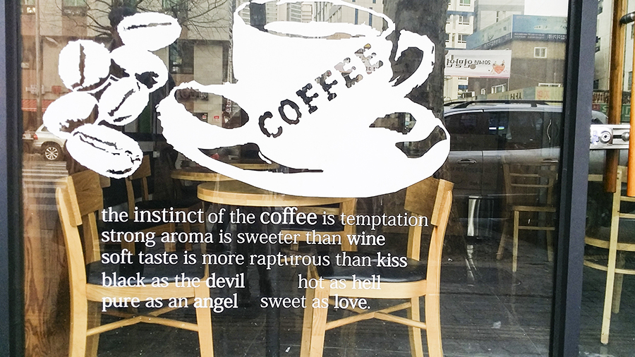 Quote outside a cafe about coffee in Seoul, South Korea.