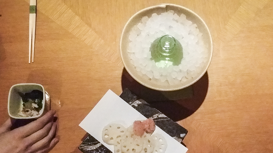 Sake in ice and fried lotus root snack dish at Momoyama, Lotte Hotel, Myeongdong, Seoul, Korea.