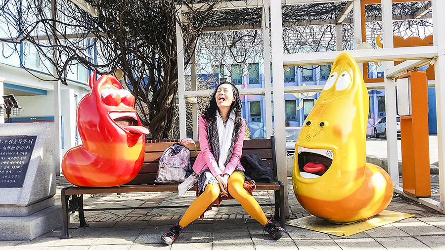 Posing with Red and Yellow sculptures at Seoul Animation Center, South Korea.