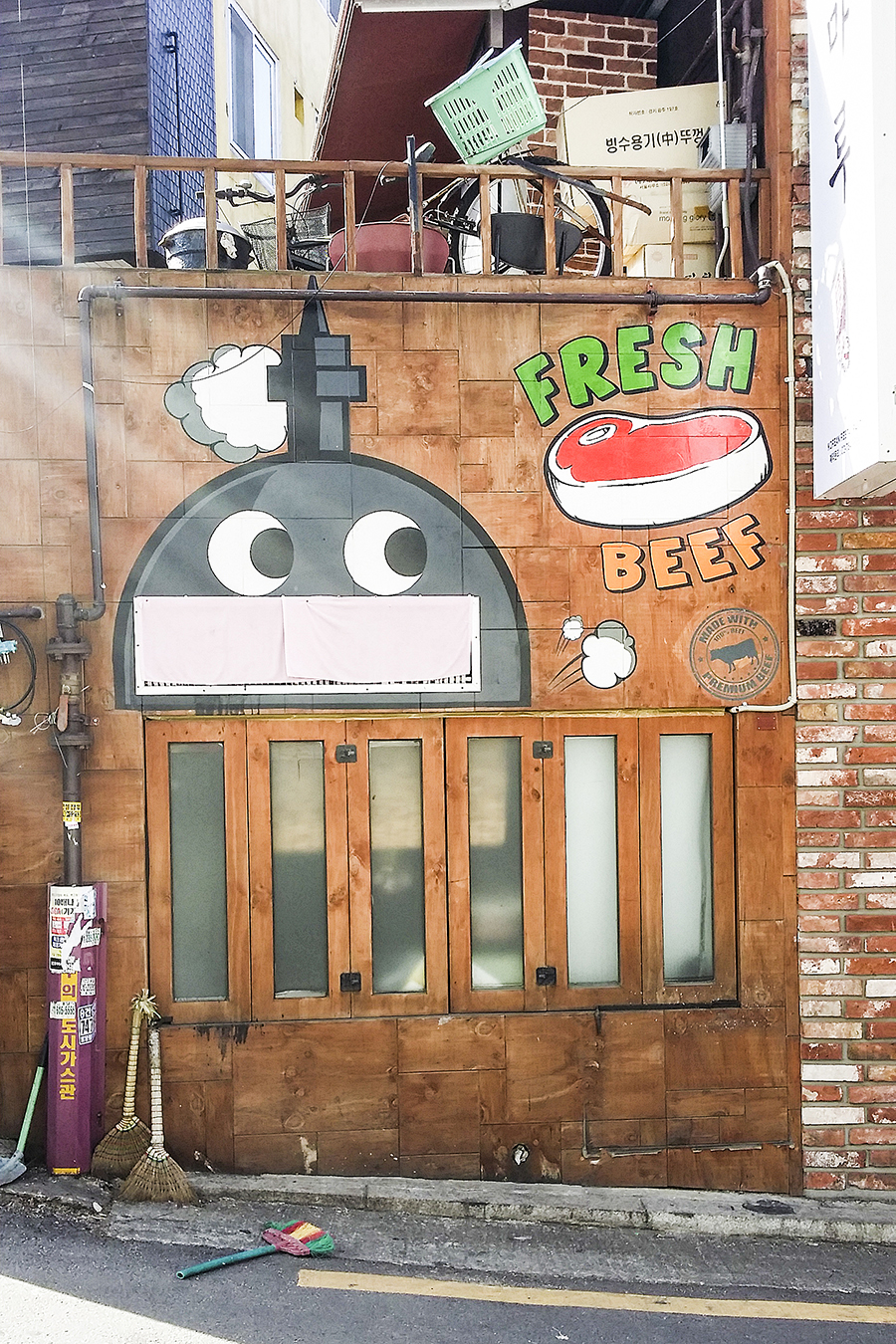 Robot mural on a shop facade at Zaemiro Seoul Comics Road, South Korea.
