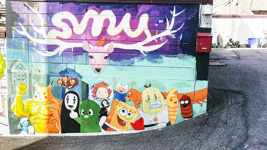 Pop culture mural featuring No Face (Spirited Away), Ponyo, Spongebob Squarepants, Adventure Time, Pikachu muscleman at Zaemiro Seoul Comics Road, South Korea.