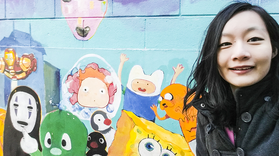 Selfie with Pop culture mural featuring No Face (Spirited Away), Ponyo, Spongebob Squarepants, Adventure Time, Pikachu muscleman at Zaemiro Seoul Comics Road, South Korea.